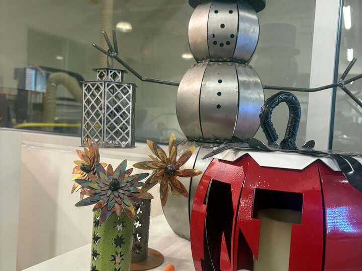 Metal projects including snowman, flowers, and pumpkin
