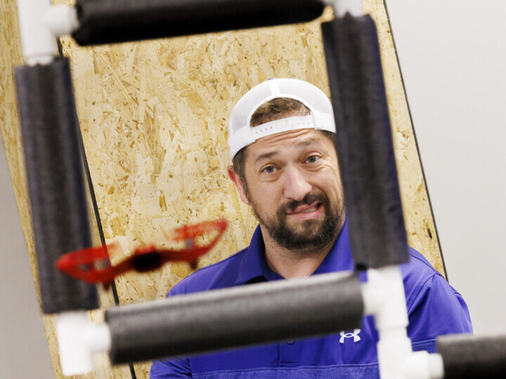 Pilot flying a small Tello Drone